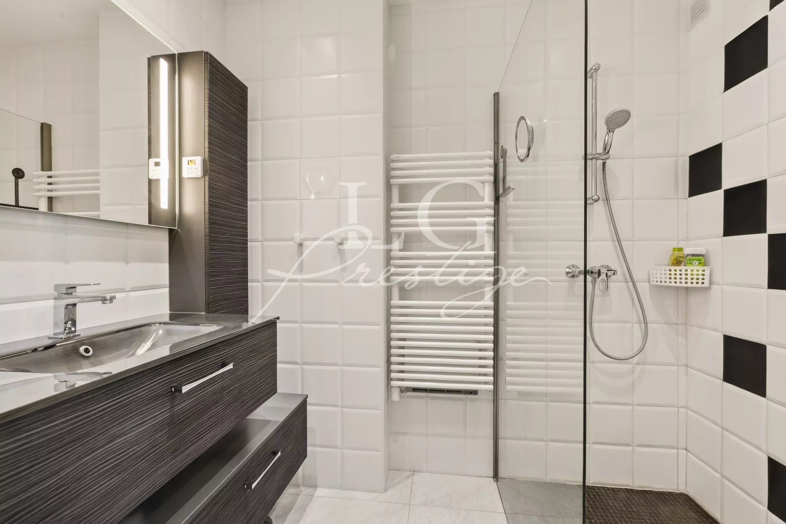 Modern bathroom Modern bathroom with shower and sink, black and white tiles.