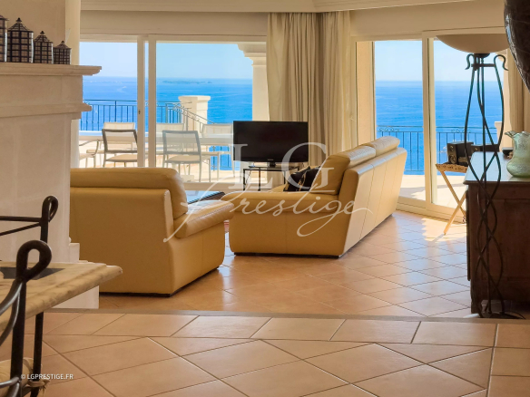Interior of a Provençal villa with sea view, bright living room and terrace.