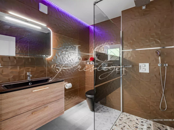 Modern bathroom with walk-in shower and wooden vanity unit, LED lighting.
