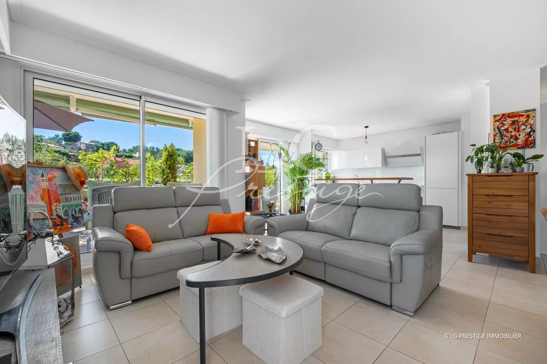 Living room of an apartment in Mandelieu-la-Napoule Interior of a modern apartment with a bright living room and open kitchen in Mandelieu-la-Napoule.