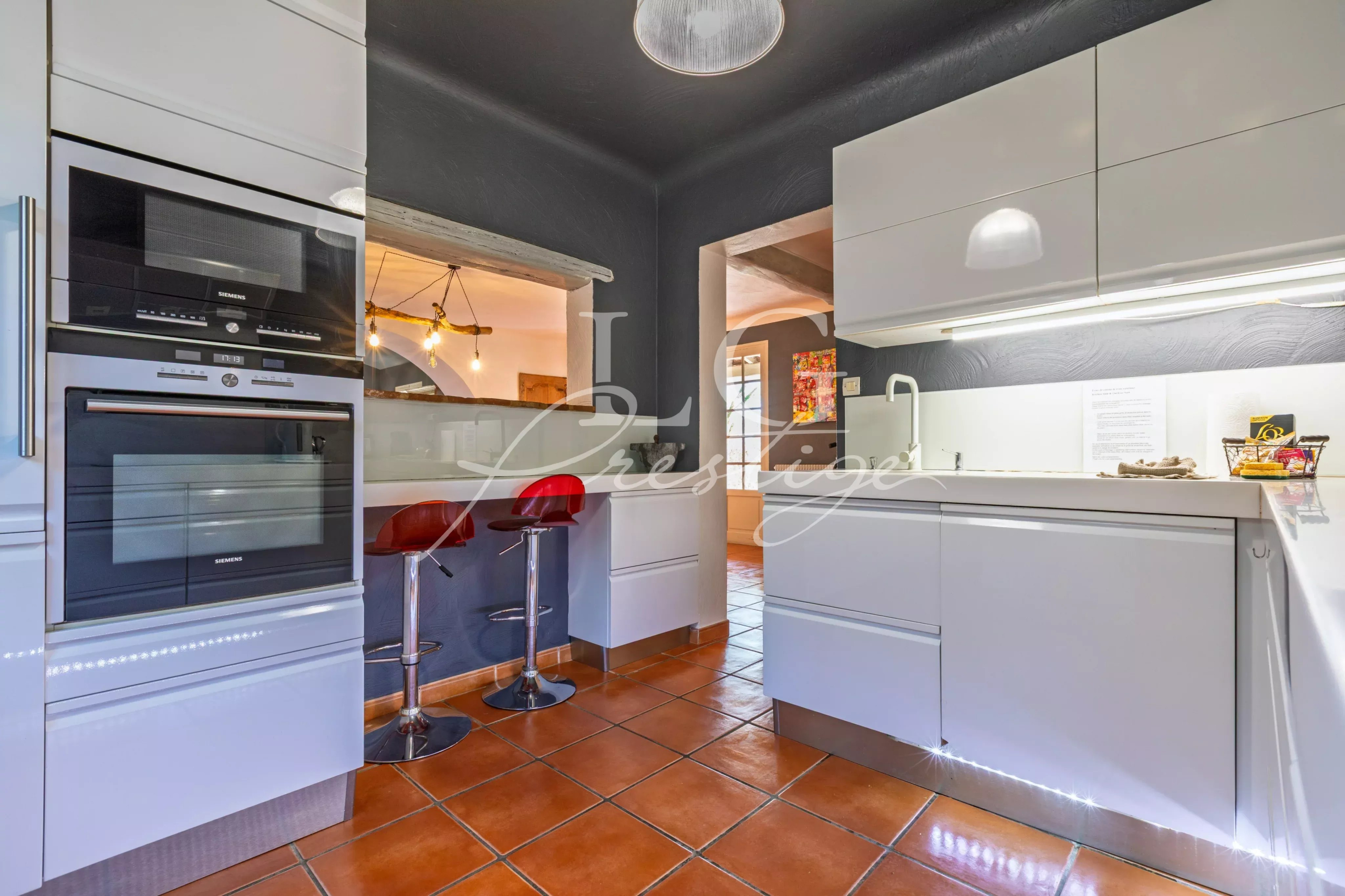Kitchen of a Provençal villa in Seillans Modern kitchen with bar and contemporary equipment in a villa in Seillans.