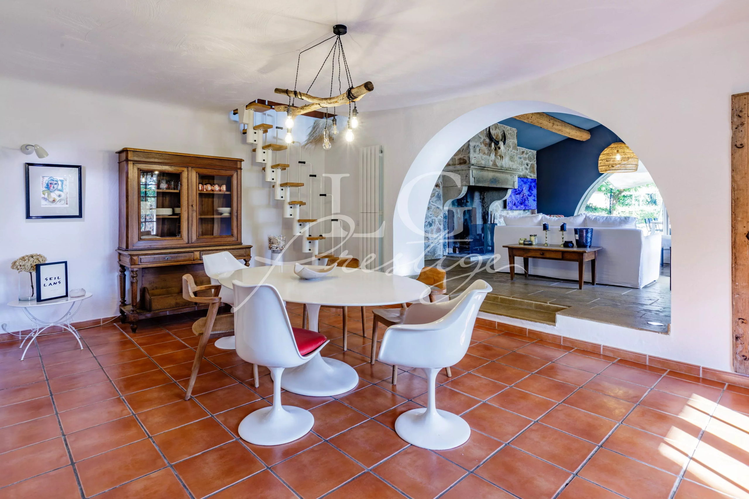 Interior of the Provençal villa Interior of a Provençal villa with dining room and fireplace, warm and bright atmosphere.