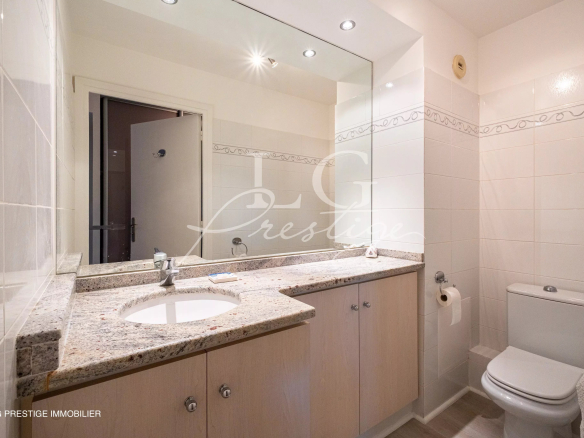 Bathroom with double sink and toilet in an apartment in Mandelieu-la-Napoule.