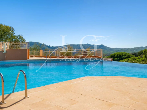 Infinity pool in a residence with mountain views.