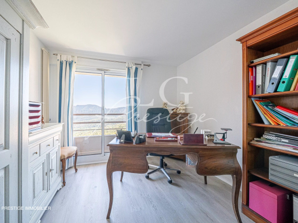 Office in an apartment with sea view, modern furniture and storage.