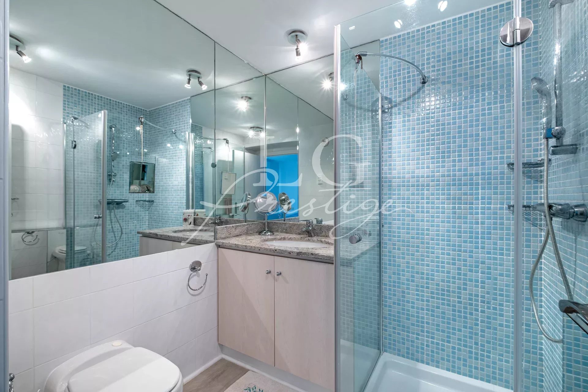 Modern bathroom Modern bathroom with glass shower and blue tiles.