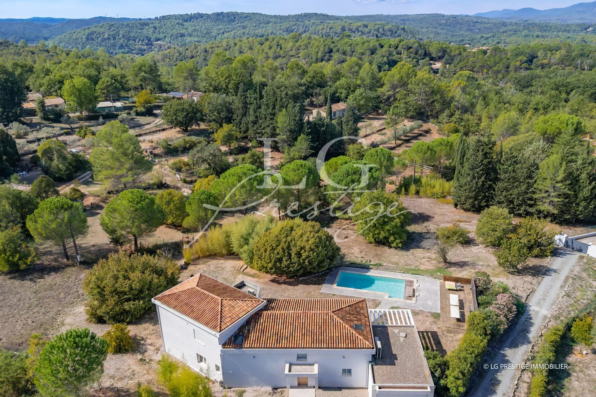 Contemporary villa in Montauroux Aerial view of a contemporary villa with swimming pool in Montauroux, surrounded by greenery.