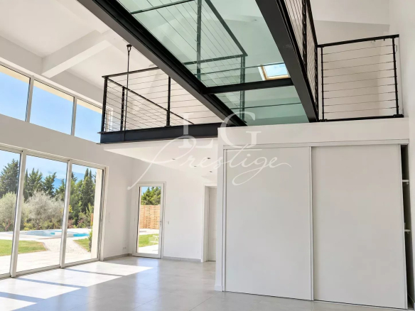 Interior of a contemporary villa with cathedral ceiling living room and mezzanine.