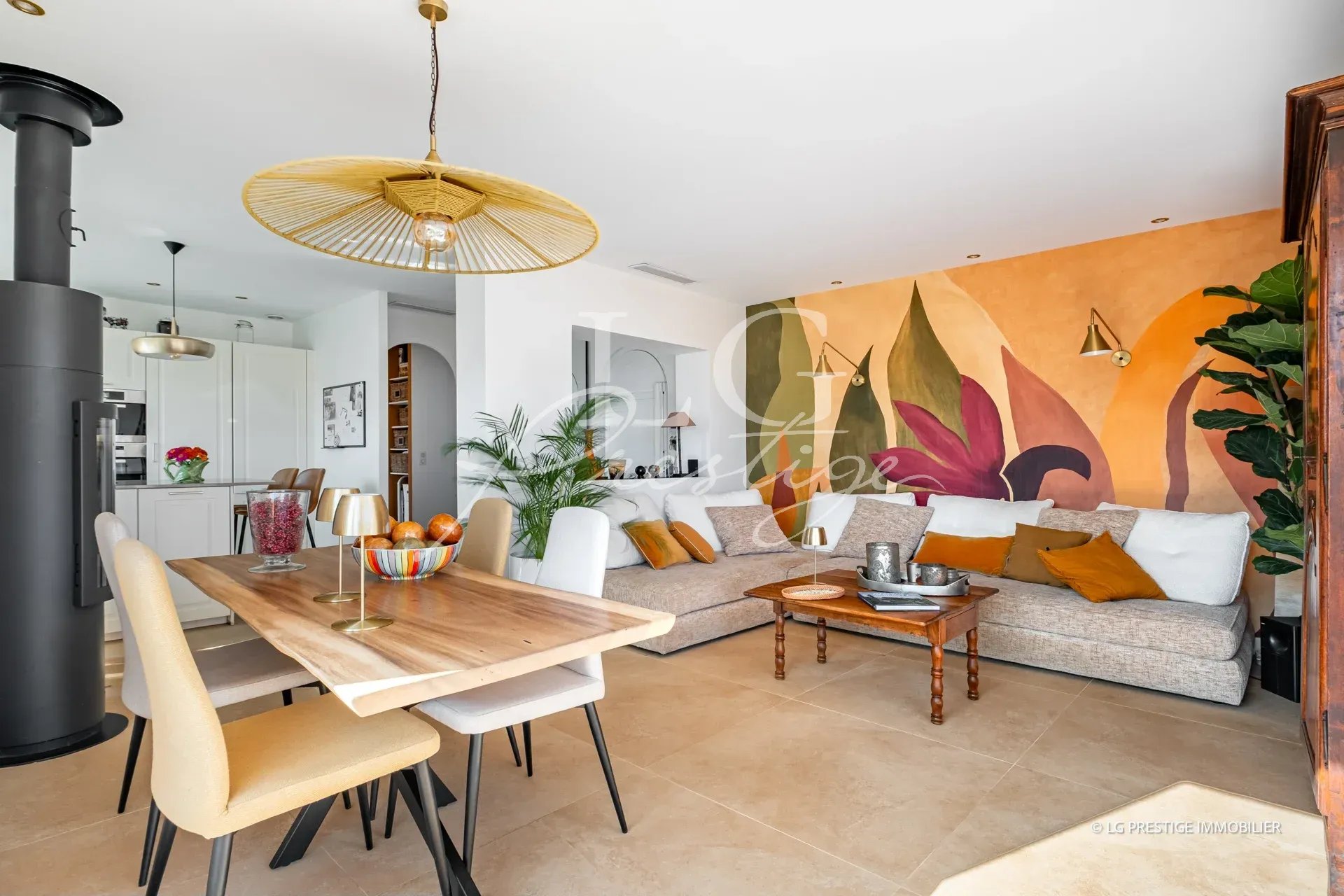 Interior of a villa in Mandelieu-la-Napoule Interior of a renovated villa with a bright living room, dining table and modern decor.