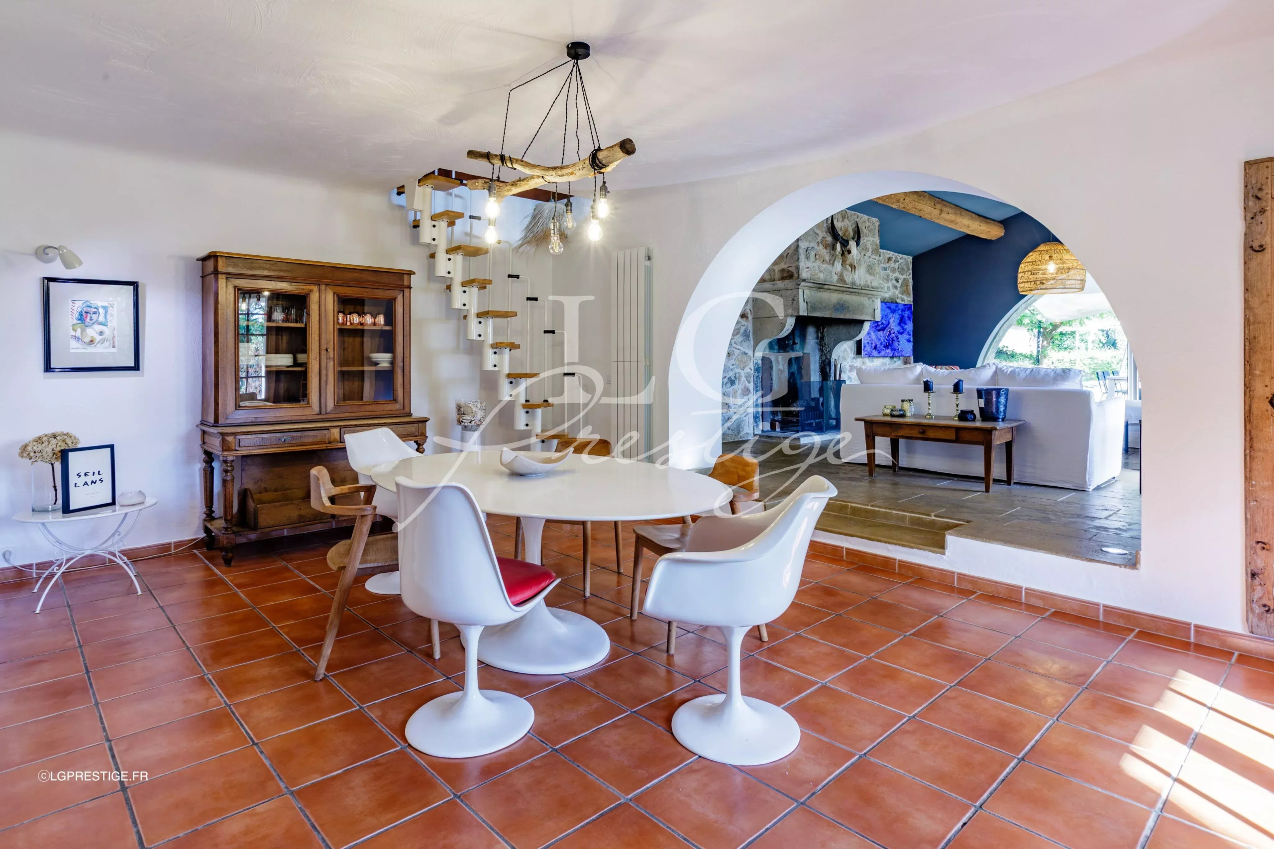 Interior of a Provençal villa Interior of a Provençal villa with dining room and fireplace, warm decor.