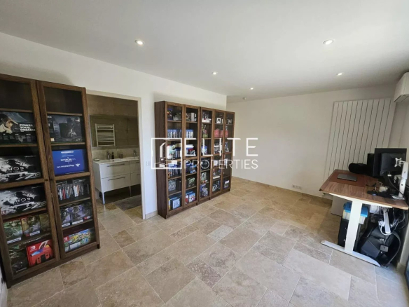 Interior of a house in Cabris with shelves and a desk.