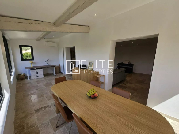 Interior of a house in Cabris with a bright dining room and modern furniture.