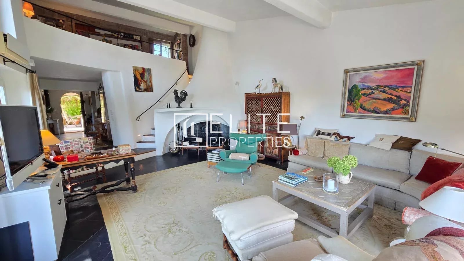 Living room of a house in Mouans-Sartoux Interior of a 5-room house with a bright living room and fireplace.