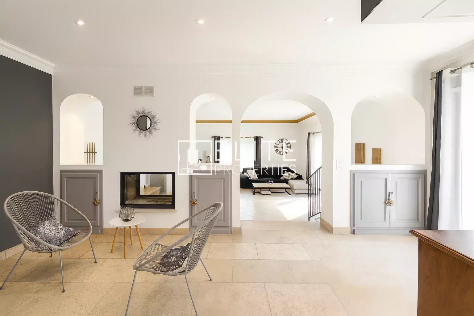 Interior of a modern villa with fireplace and sitting area in Grasse