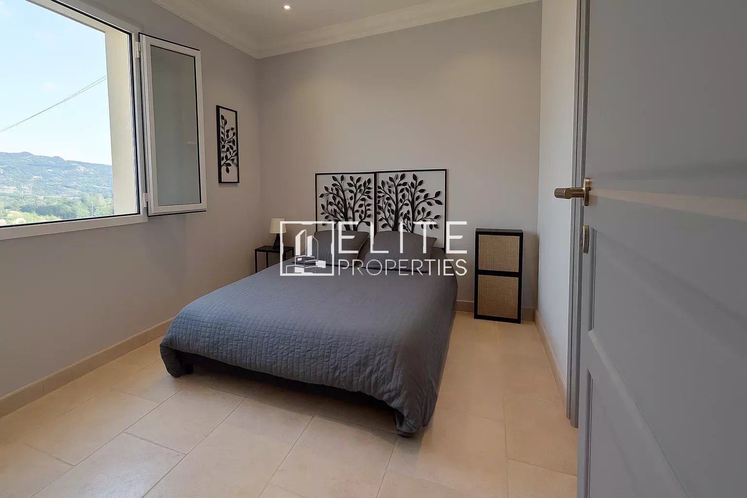 Room in a modern villa in Grasse, with bed and simple decor.