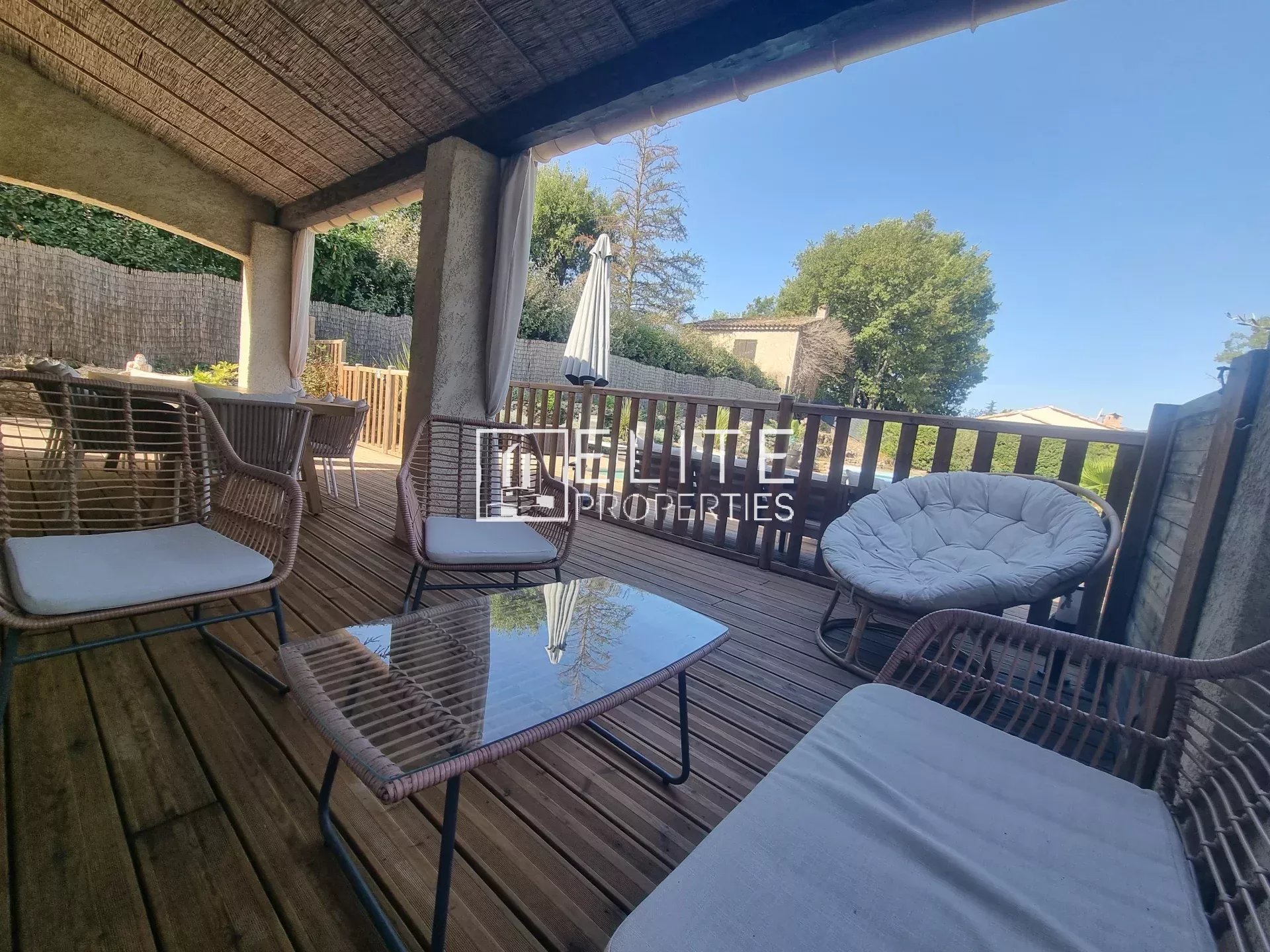 Villa terrace in Fayence Wooden terrace with garden furniture in a villa in Fayence.