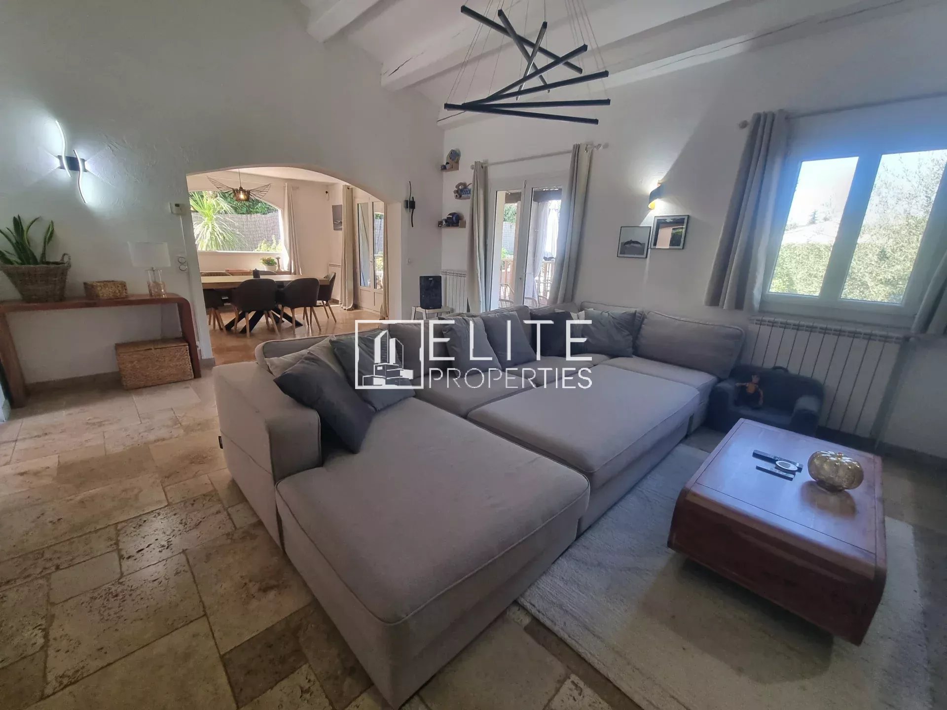 Interior of a villa in Fayence Interior of a villa in Fayence with a large living room and a comfortable sofa.