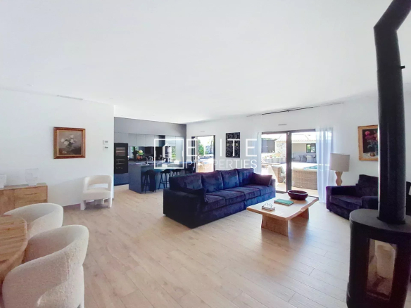 Interior of a renovated villa in Vallauris with a spacious living room and open kitchen.