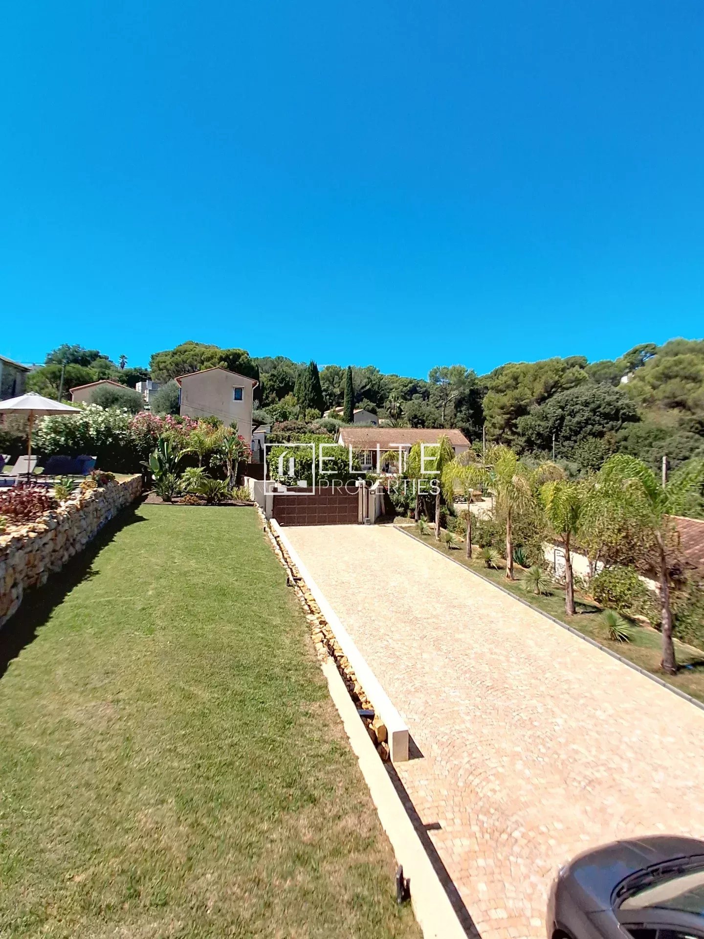 Charming villa in Vallauris View of a renovated villa with garden and paved driveway in Vallauris.