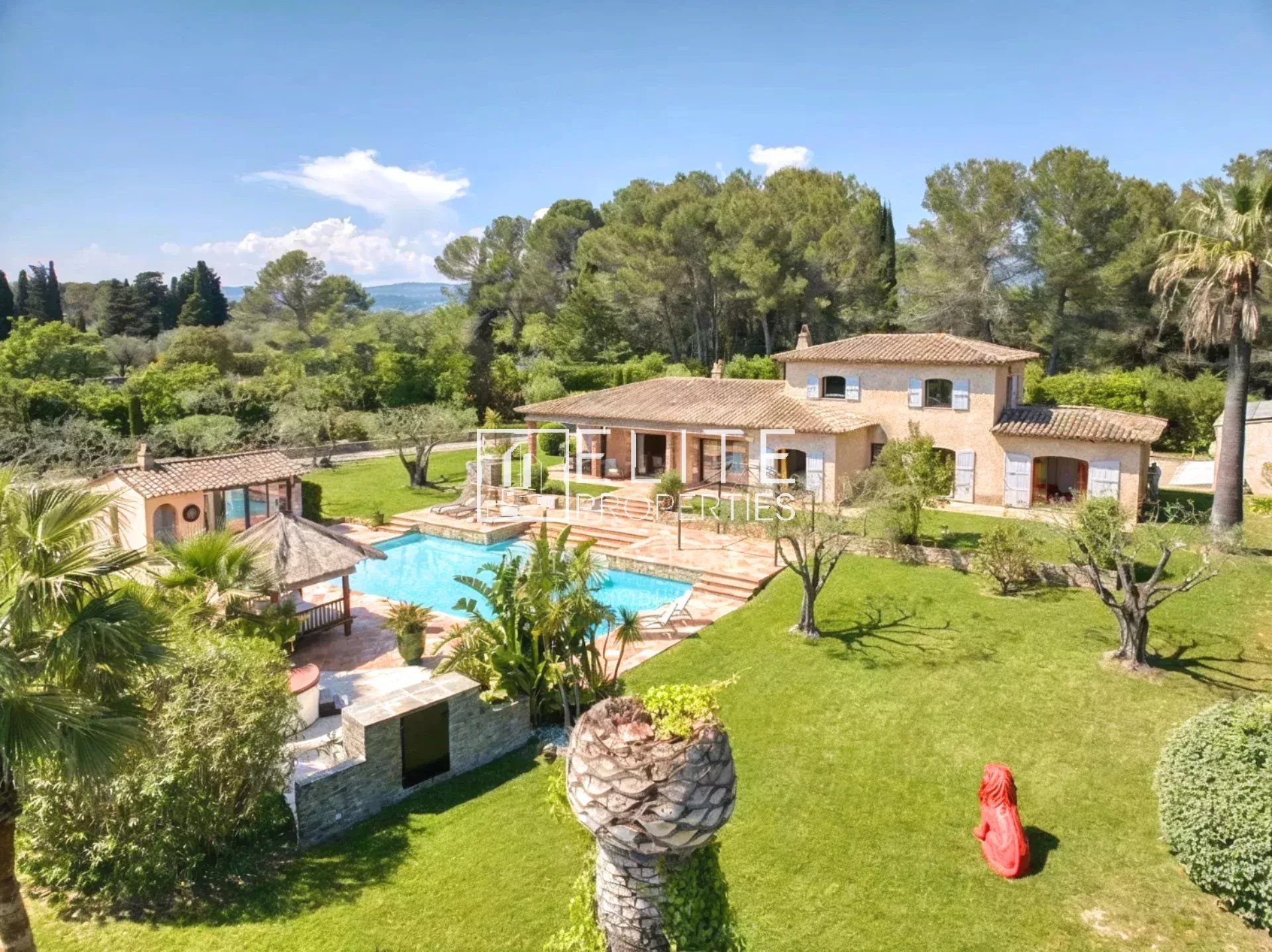 Family property in Mouans-Sartoux Aerial view of a villa surrounded by landscaped grounds and a swimming pool in Mouans-Sartoux.