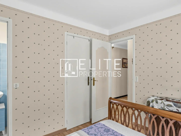 Interior of a house to be renovated with patterned walls and white doors.