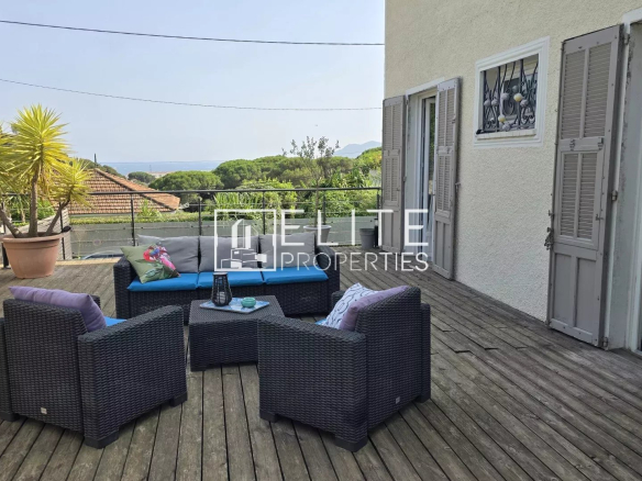 Wooden terrace with garden furniture and sea view in Cannes La Bocca.