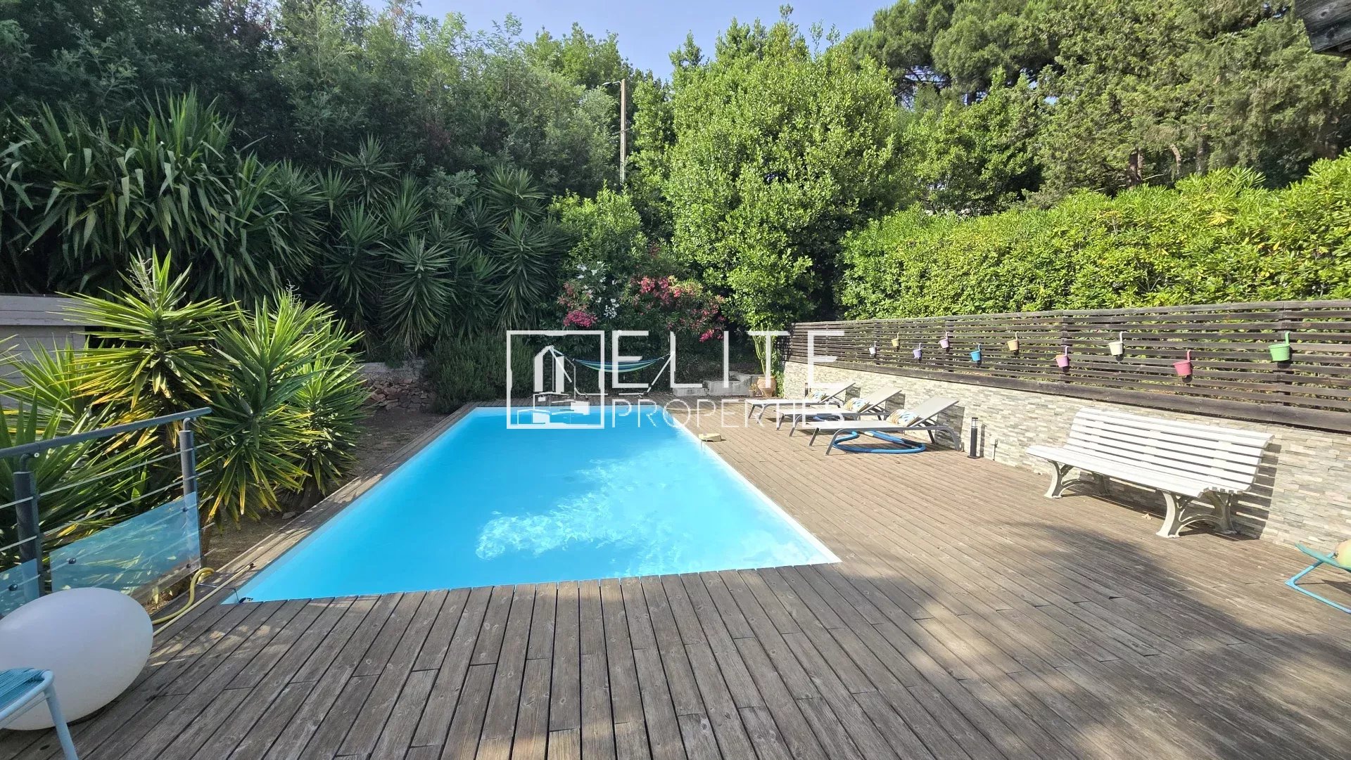 House with swimming pool in Cannes La Bocca Swimming pool surrounded by vegetation in a house in Cannes La Bocca.