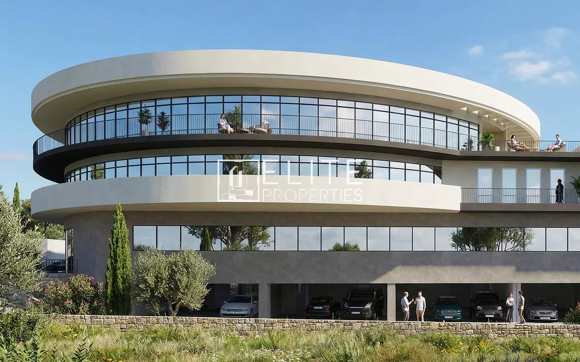Immeuble moderne avec grandes baies vitrées, espace commercial au rez-de-chaussée à Grasse.
