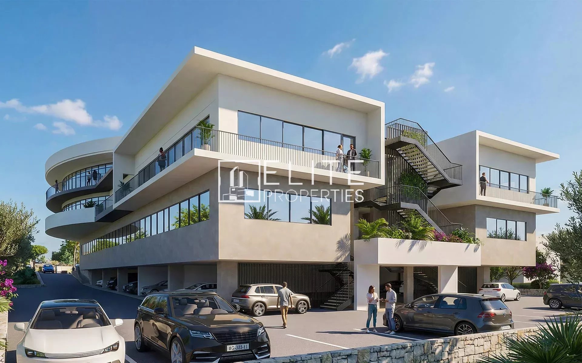 Immeuble commercial à Grasse avec stationnement et accès à plusieurs niveaux.