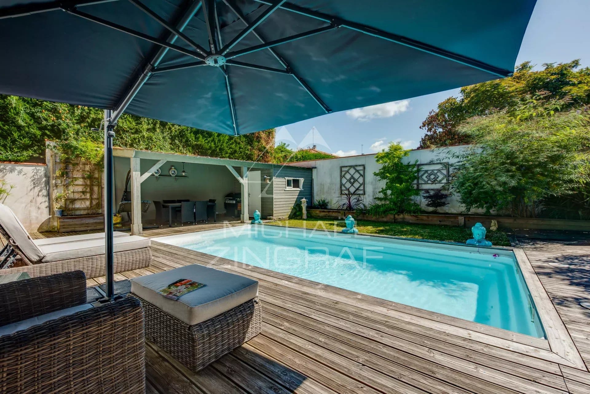 4-bedroom apartment with private pool in Anglet Private swimming pool with wooden terrace and parasol in a garden of a 4-room apartment in Anglet.
