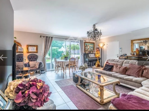 Interior of a bright 4-room apartment with living room, modern furniture and access to the garden.