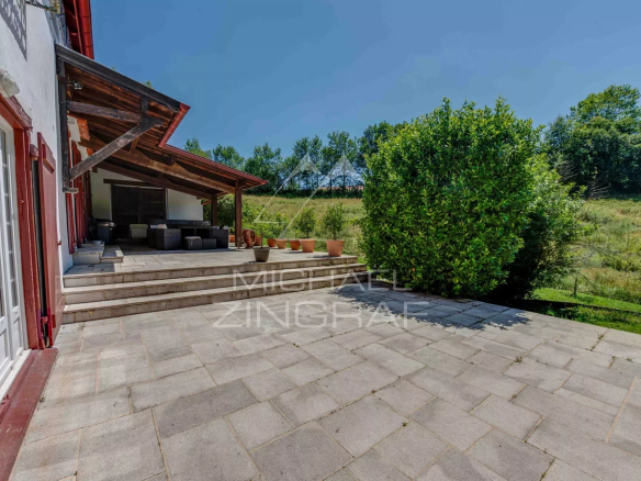 Terrace of a renovated old farmhouse with a view of the forest, Basque Country.