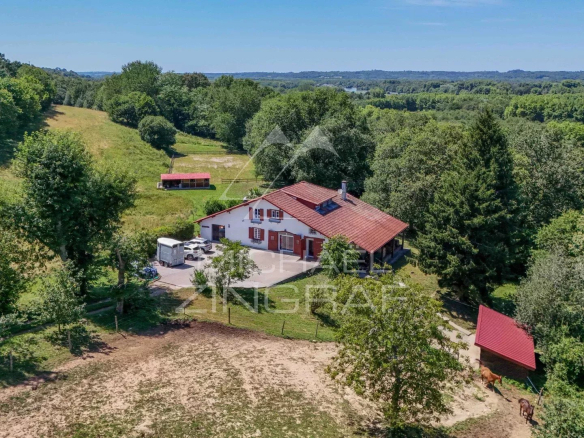 Renovated old farmhouse on the edge of the forest, surrounded by greenery, Basque Country.