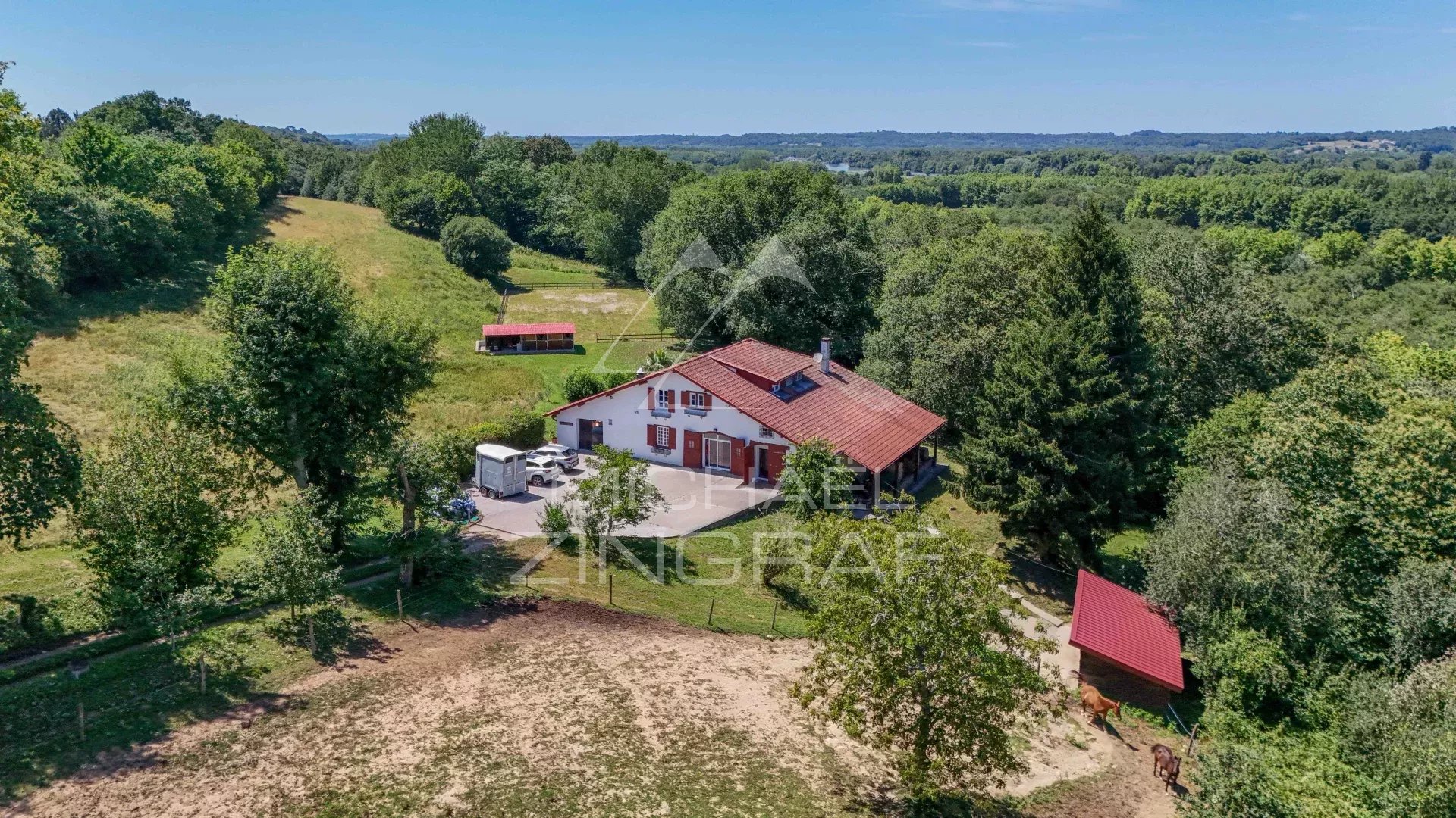 Renovated old farmhouse on the edge of the forest, surrounded by greenery, Basque Country.