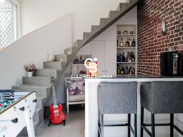 Interior of a characterful house with modern staircase and bar, Suresnes.