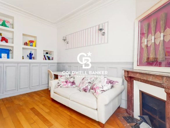 Interior of a characterful house with living room and fireplace in Suresnes