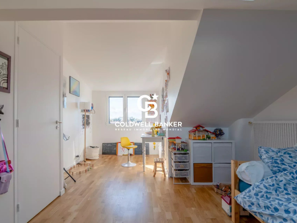 Interior of a house with a bright space, modern furniture and wooden parquet flooring.