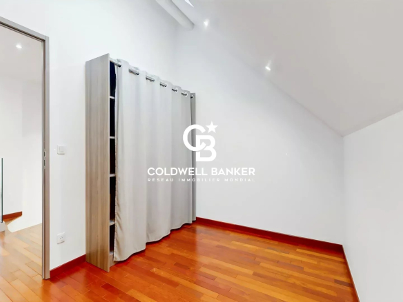 Interior of a contemporary house with wooden parquet floors and curtains