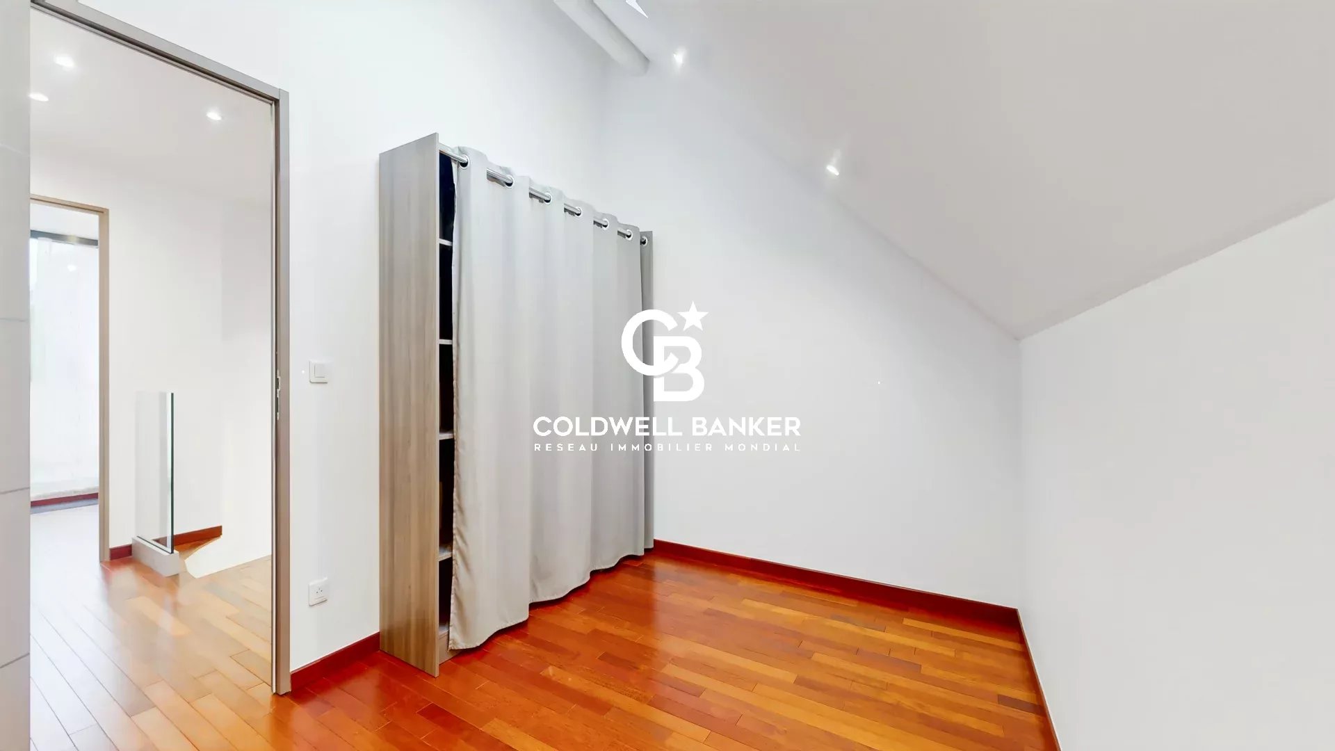 Interior of a contemporary house in Sceaux Interior of a contemporary house with wooden parquet floors and curtains
