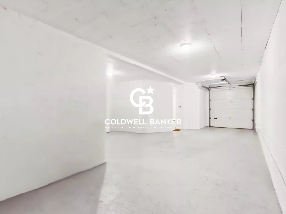 Interior of a spacious and empty garage in a contemporary house in Sceaux.