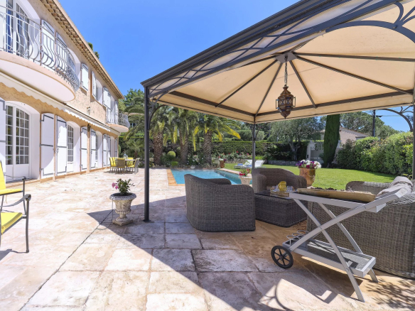 Terrace of a renovated country house with garden furniture and swimming pool, Le Cannet