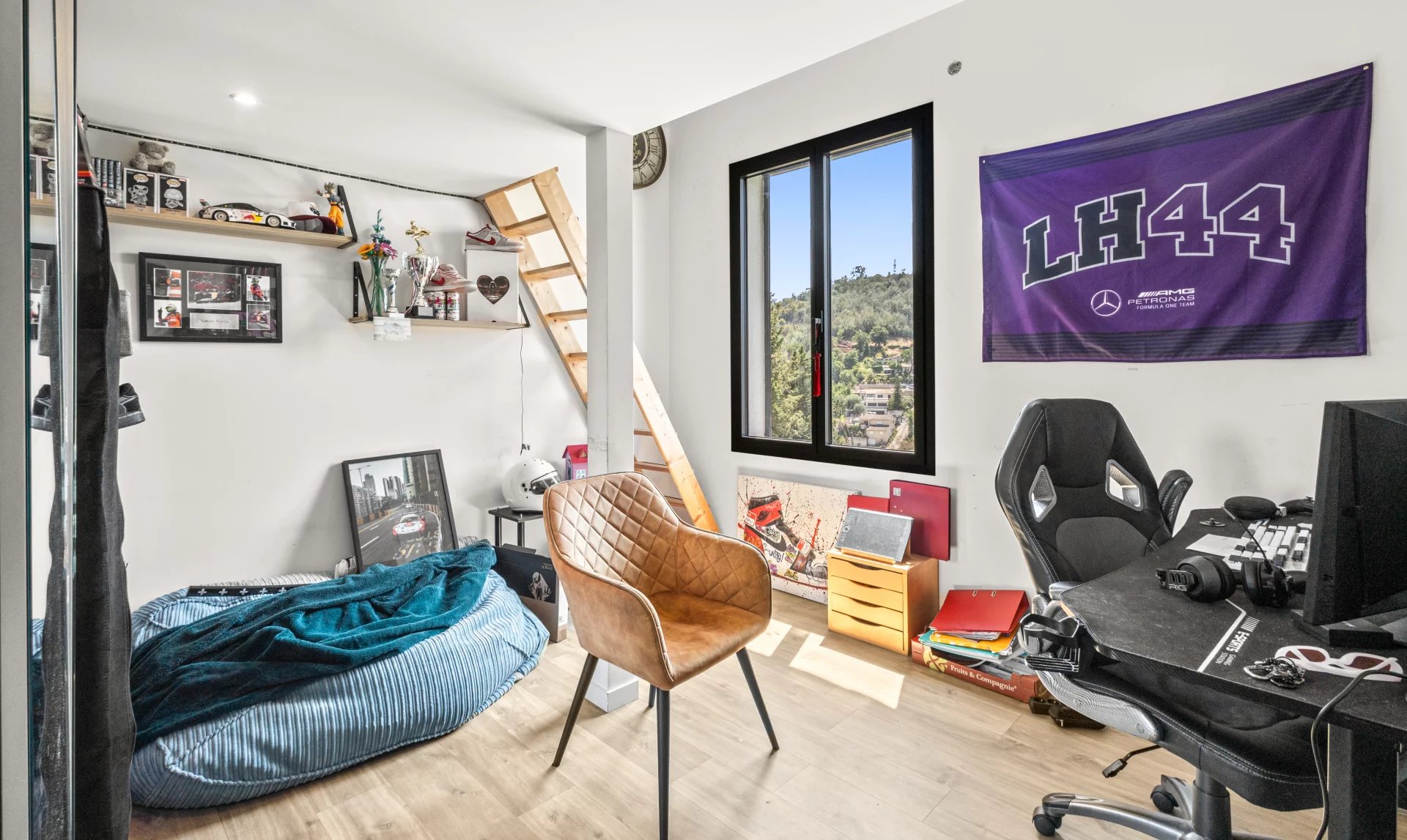 Bedroom with desk and decor Bright room with desk, armchair and sporty decor.