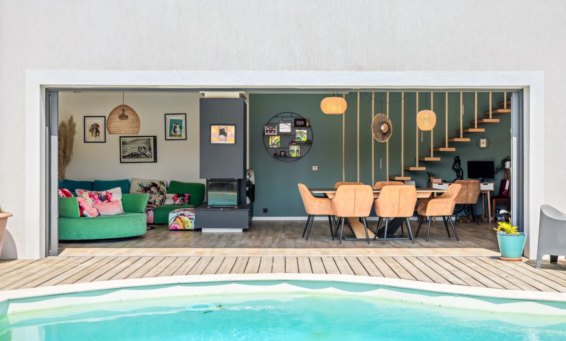 Interior of a villa with a swimming pool View of the interior of a modern villa with swimming pool, living room and dining room.