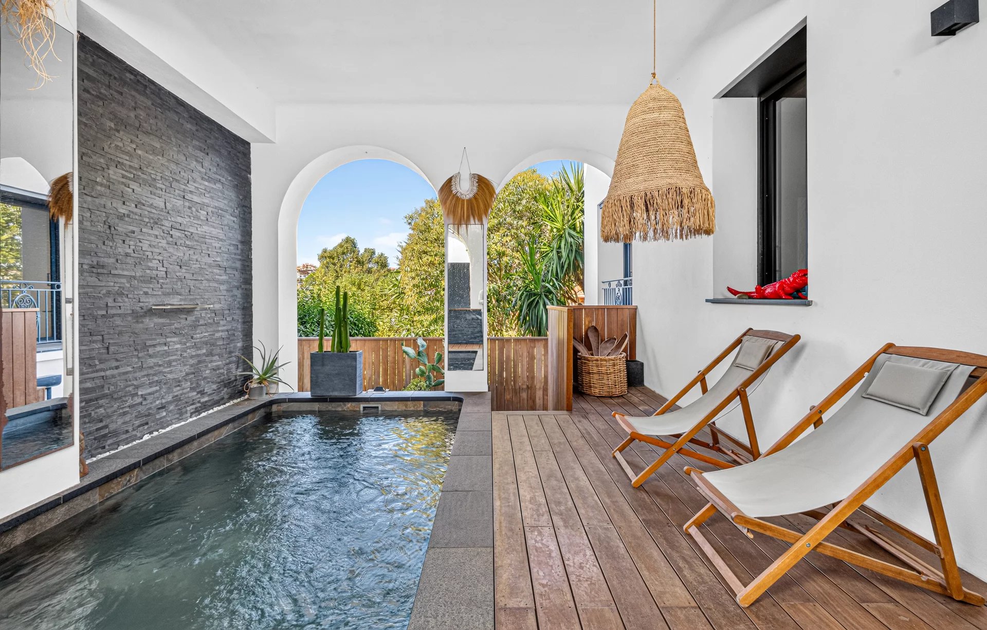 Belle Époque villa in Petit Juas Interior of a renovated Belle Époque villa with swimming pool and sun loungers.