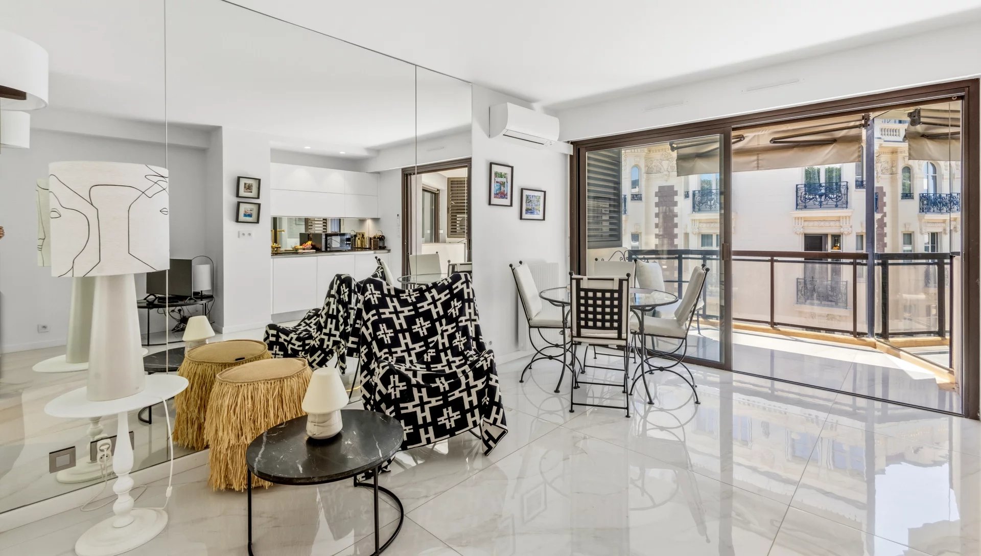 Renovated studio in Cannes Interior of a renovated studio apartment with living room, equipped kitchen and terrace in Cannes.