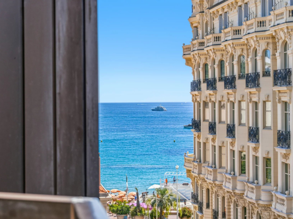 Side sea view from a balcony of a top-floor studio in Cannes.