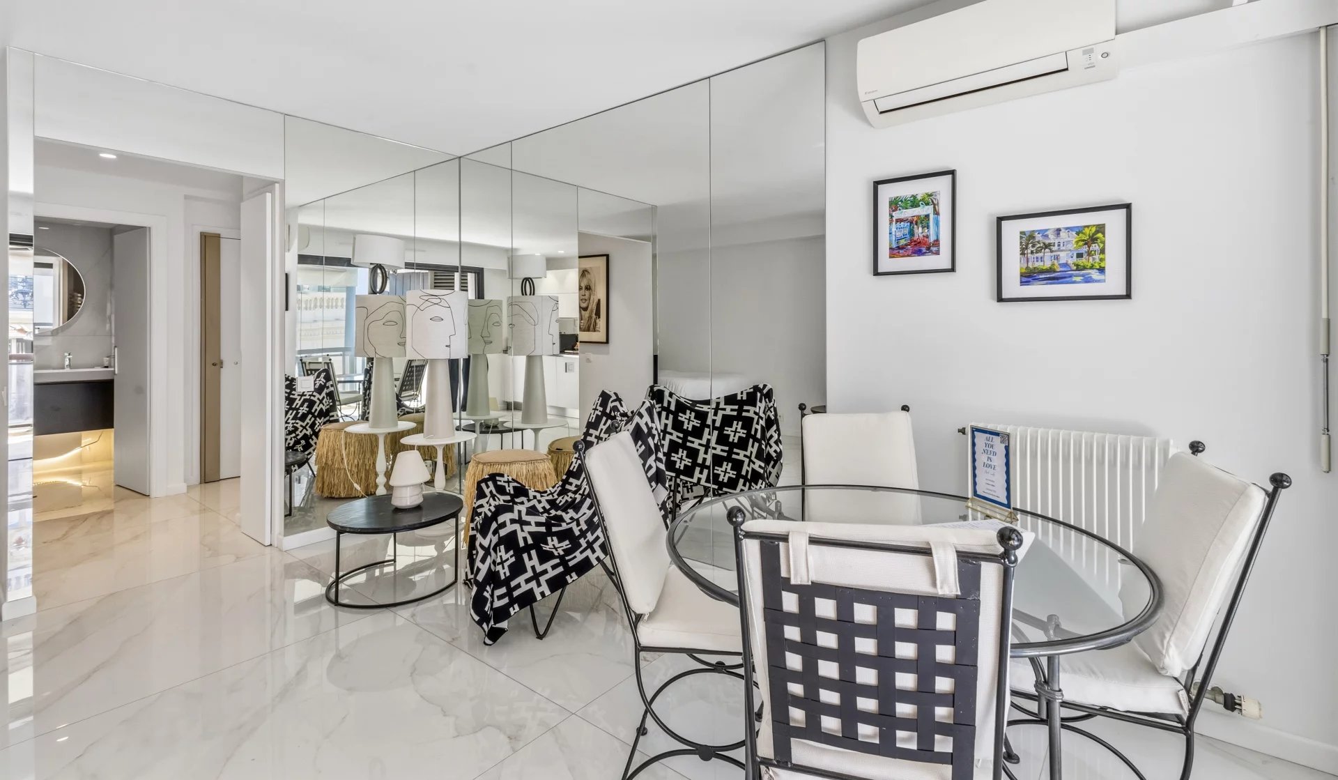 Renovated studio in Cannes Interior of a renovated studio with modern furniture and mirror, located on the top floor in Cannes.