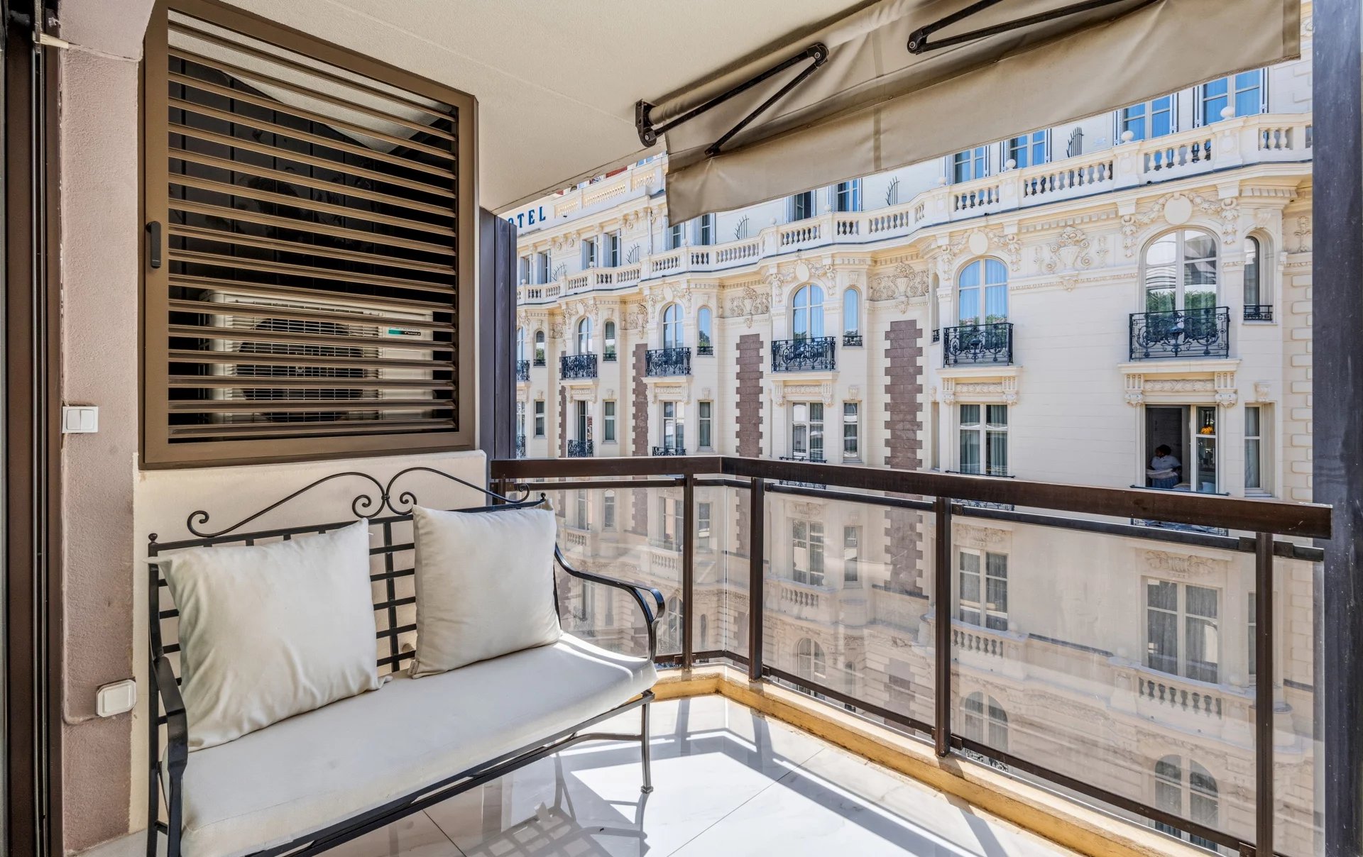 Terrace of a studio apartment in Cannes Terrace of a renovated studio on the top floor with a view of a building in Cannes.