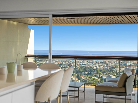 Panoramic sea and city views from an apartment in Le Cannet, with a bright living space.