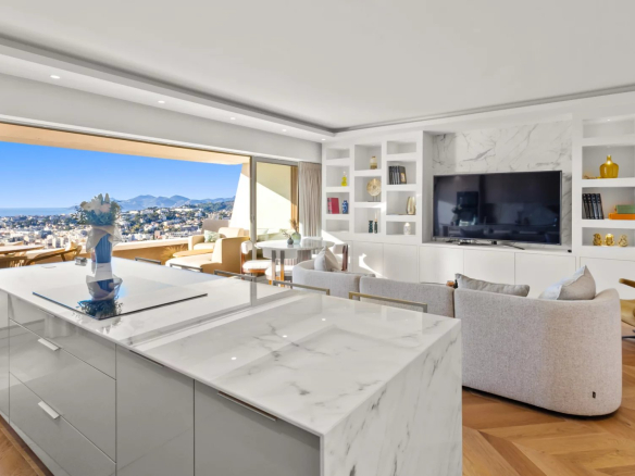 Interior of a modern apartment with panoramic views of the sea and mountains.